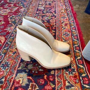 Beautiful cream-colored heeled boots
